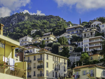 Buildings in city against sky