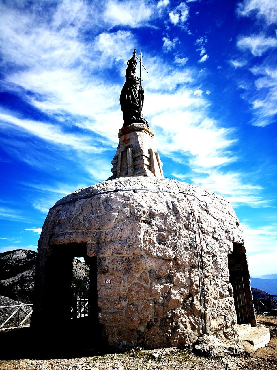 statue, sculpture, sky, human representation, cloud - sky, day, architecture, travel destinations, monument, built structure, history, no people, outdoors, low angle view, nature