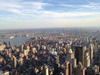 High angle view of modern buildings in city against sky