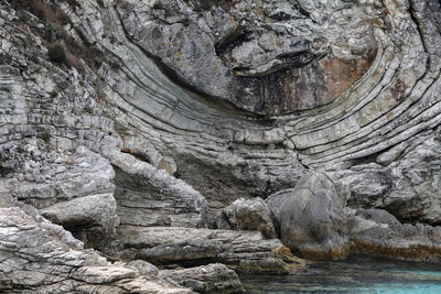 The bizarre lines of rock sculptured by nature in the ionian sea, greece