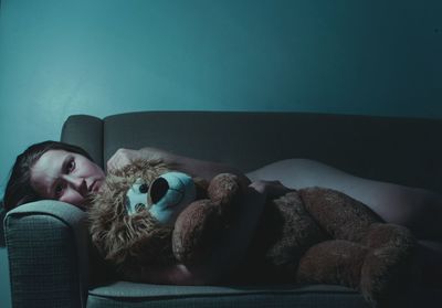 Woman holding toy at home