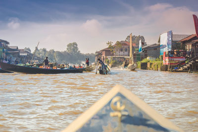 People on boats in lake