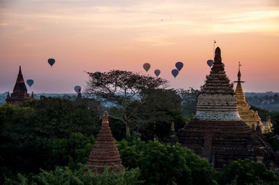 Temple against sky at sunset