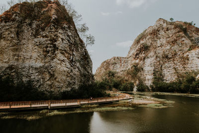 Scenic view of river amidst trees against sky