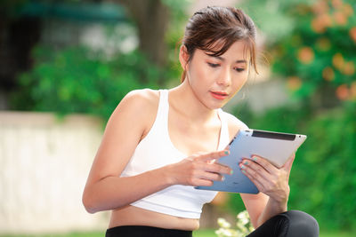 Young woman using mobile phone