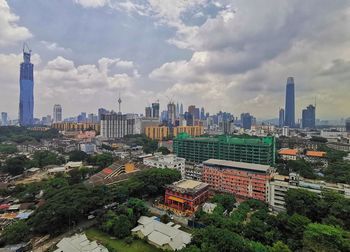 High angle view of buildings in city against sky