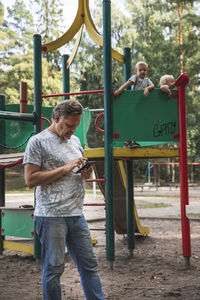 Father with kids on playground