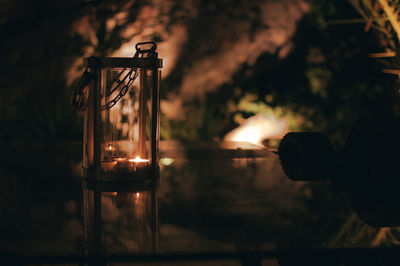 Close-up of illuminated light bulb in water