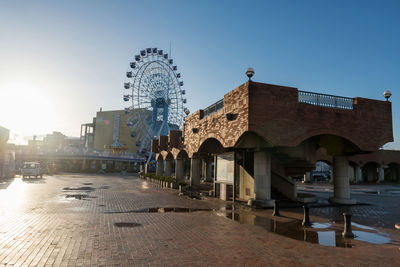 Brick bridge landmark with ferris wheel at pulse dream plaza during sunset, shizuoka. 