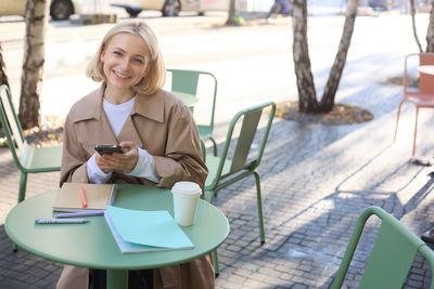 Young woman using mobile phone