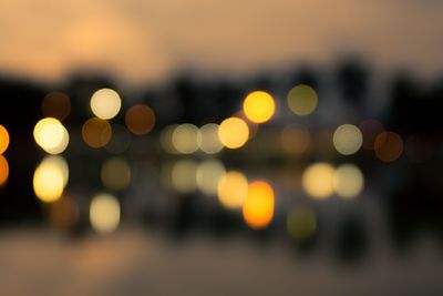 Defocused image of illuminated city at night