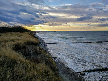 Scenic view of sea against sky during sunset