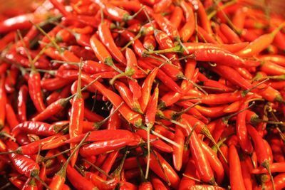 Full frame shot of red chili peppers for sale at market stall