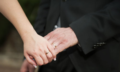 Close-up of hand holding cigarette