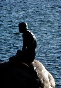 People relaxing in lake