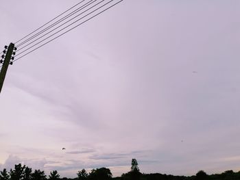 Low angle view of silhouette birds against sky