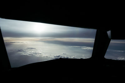 Aerial view of sky seen through airplane window