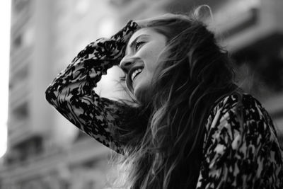 Portrait of smiling young woman outdoors