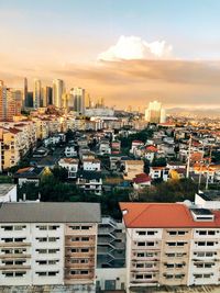 High angle view of buildings against sky at sunset