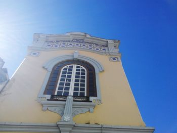 Low angle view of temple against clear blue sky