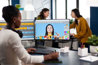 Group of people using phone while standing on table