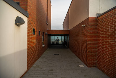 Narrow alley amidst buildings in city