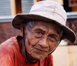 Portrait of senior woman wearing hat outdoors