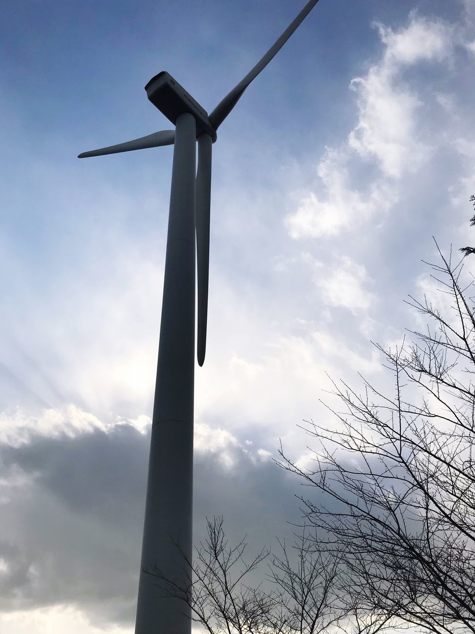 LOW ANGLE VIEW OF WINDMILLS AGAINST SKY