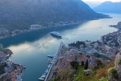 High angle view of sea by buildings in city