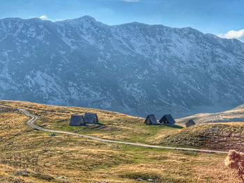 Scenic view of snowcapped mountains against sky