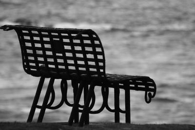 Close-up of empty bench on table at park