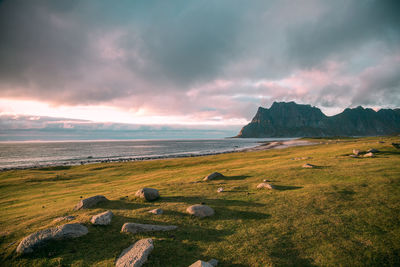 Scenic view of sea and mountains against sky during sunset, lofoten, norway