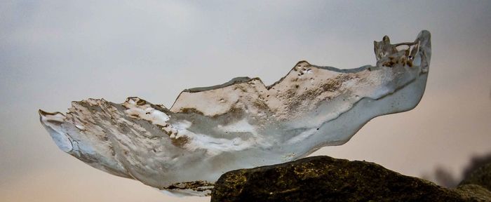 Low angle view of snow against sky