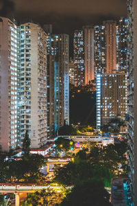 Illuminated modern buildings in city at night