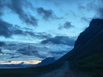 Scenic view of mountains against sky at sunset