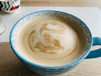 Close-up of cappuccino on table