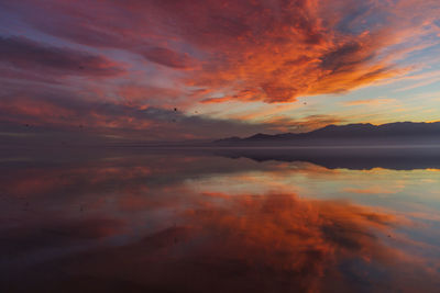 Scenic view of lake against sky during sunset