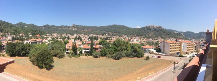 Panoramic view of town against clear sky