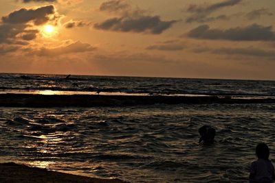 Scenic view of sea at sunset