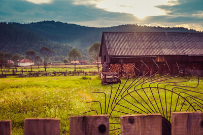 Agricultural field against sky during sunset