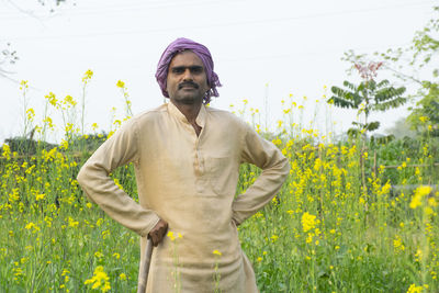 Portrait of man standing on field