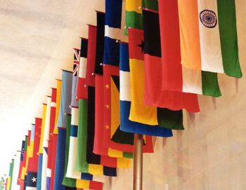 Low angle view of multi colored flags hanging on pole