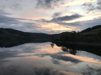 Scenic view of lake against sky during sunset