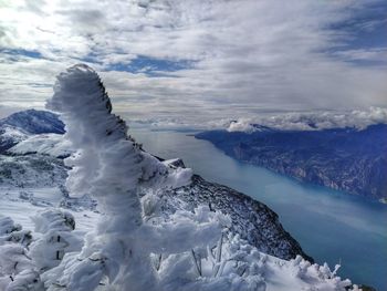 Scenic view of frozen lake against sky during winter