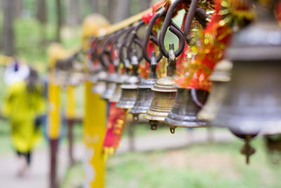 Close-up of bell hanging at market stall