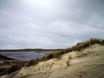 Scenic view of beach against sky