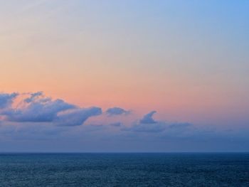 Scenic view of sea against sky at sunset