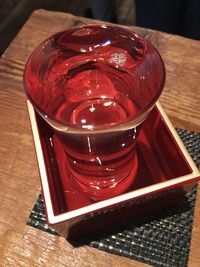 Close-up of red drink on table