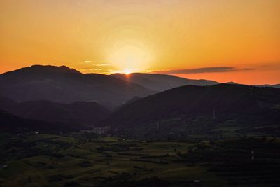 Scenic view of mountains against sky during sunset