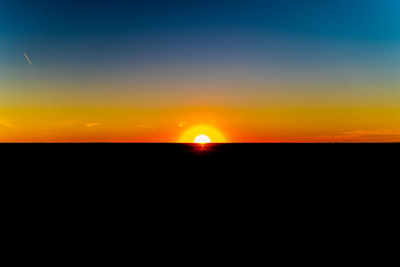 Scenic view of silhouette landscape against romantic sky at sunset